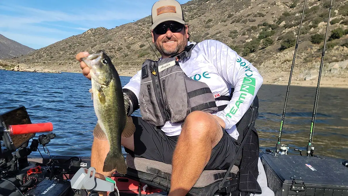 Hookup Bait creator Chad Gierlich on his kayak with a fish.