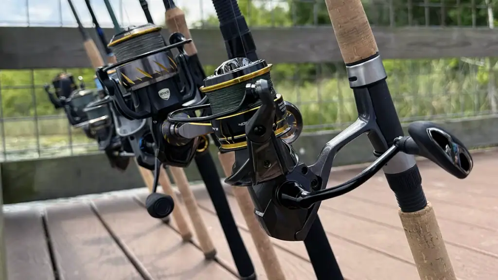 Spinning reels leaning against a dock