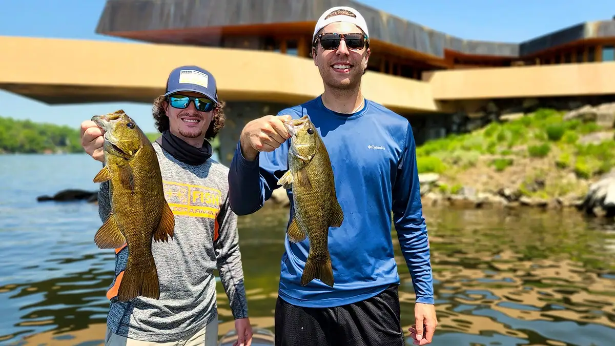Two man hold up the bass they caught with one of the top five bait for post-spawn smallmouth success.
