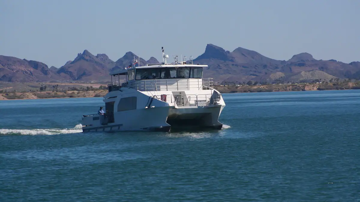 White boat cruising the blue waters of Lake Havasu.