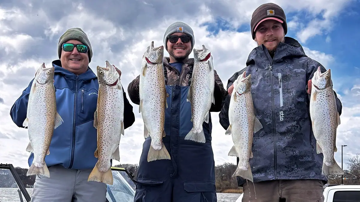 Three anglers show off the catches they owe to some lucky charms and doing all the right pre-fishing rituals.