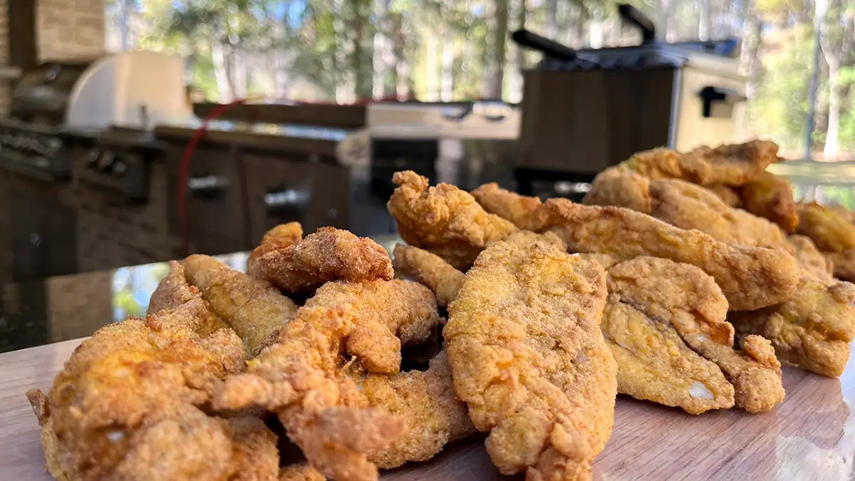 A pile of freshly fried blue cat fillets is the whole point of Mike Jones' June strategy.