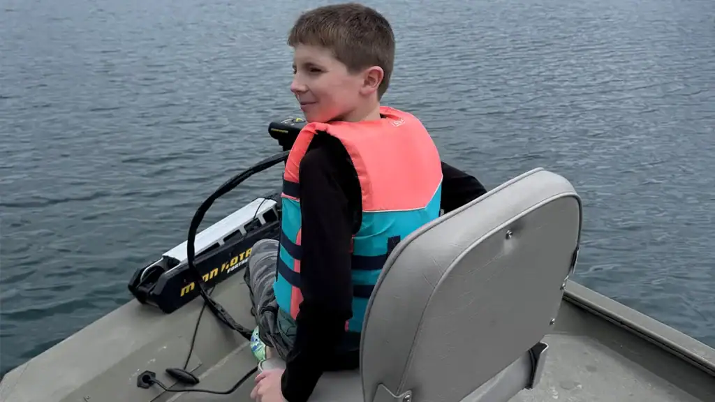 kid and trolling motor