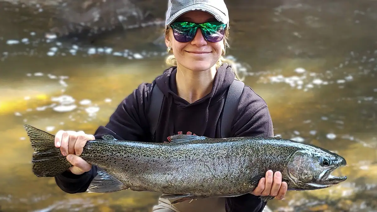 Lucy Spatafore with the Minnesota-state-record rainbow trout she caught last year.