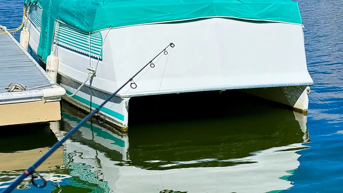Pontoon boats often hold bass on bright sunny days, preferred for both their shade and often uneven bottom structure created by turbulence from the boat’s engine when warming up or docking.