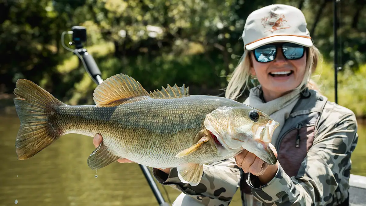 Pro kayak angler Kristene Fisher with what might be a meanmouth bass.