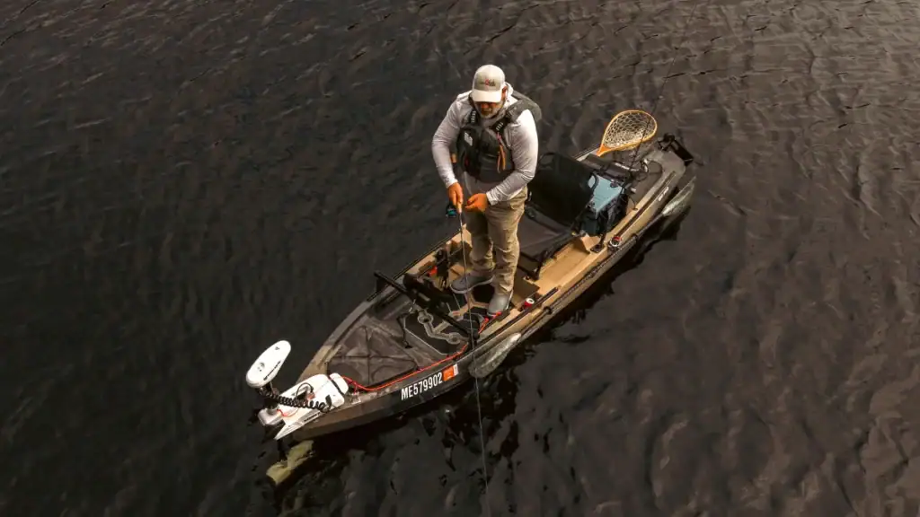 angler standing in Old Town Sportsman 120 Pro_