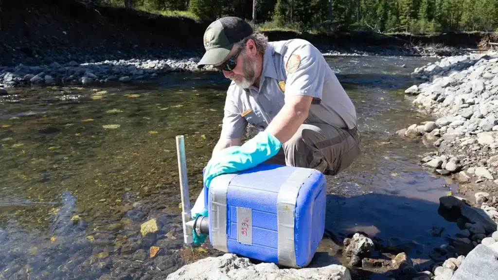 Biologist using rotenone NPS