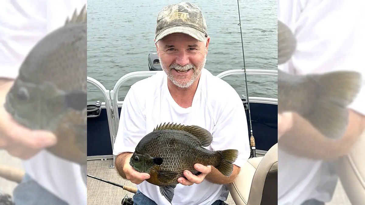 Dale Hoffman had reasons to smile when he caught a Minnesota state-record bluegill in early July. His fish weighed 2.21 pounds.