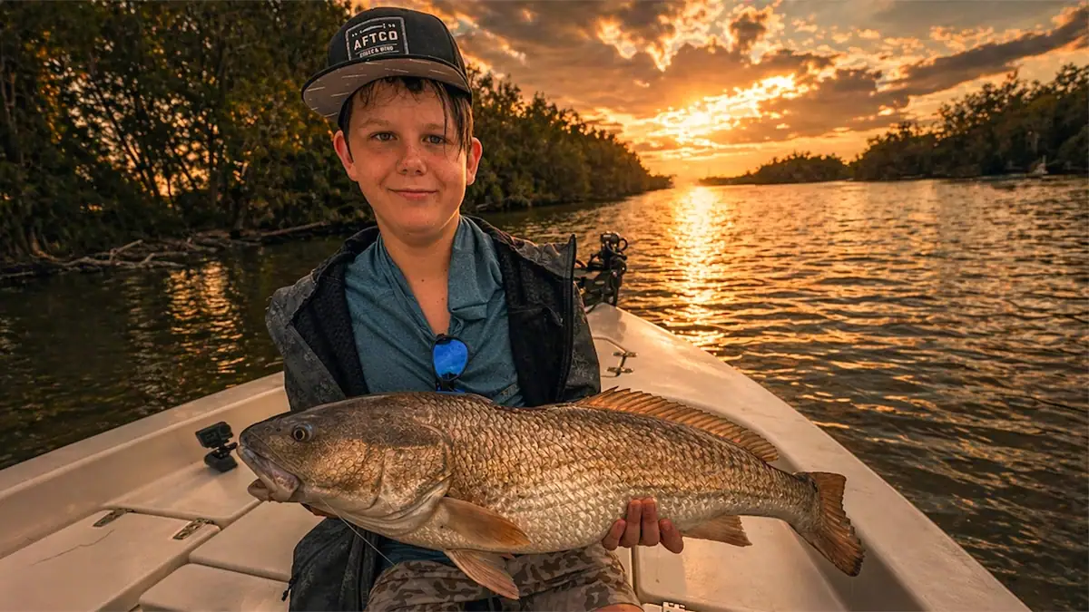 12-year-old Finnegan "Fin" Arnold shows off one of his record catches.