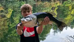 Lunker Largemouth Caught By 13-Year-Old Fishing A Worm On A Zebco Rod-And-Reel Combo