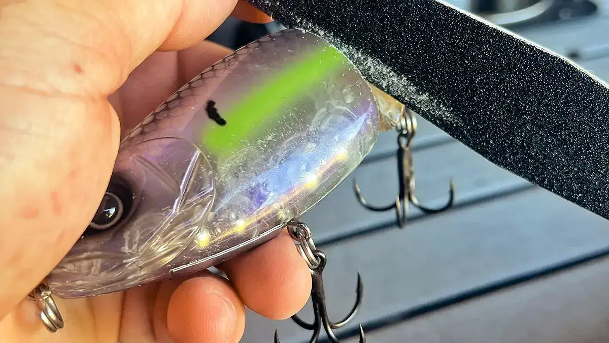 Slightly shave the edge of the joint on both sides of the glidebait's head portion to create a wider action.
