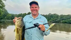 Shaye Baker with a modified glidebait and the fish it helped catch.